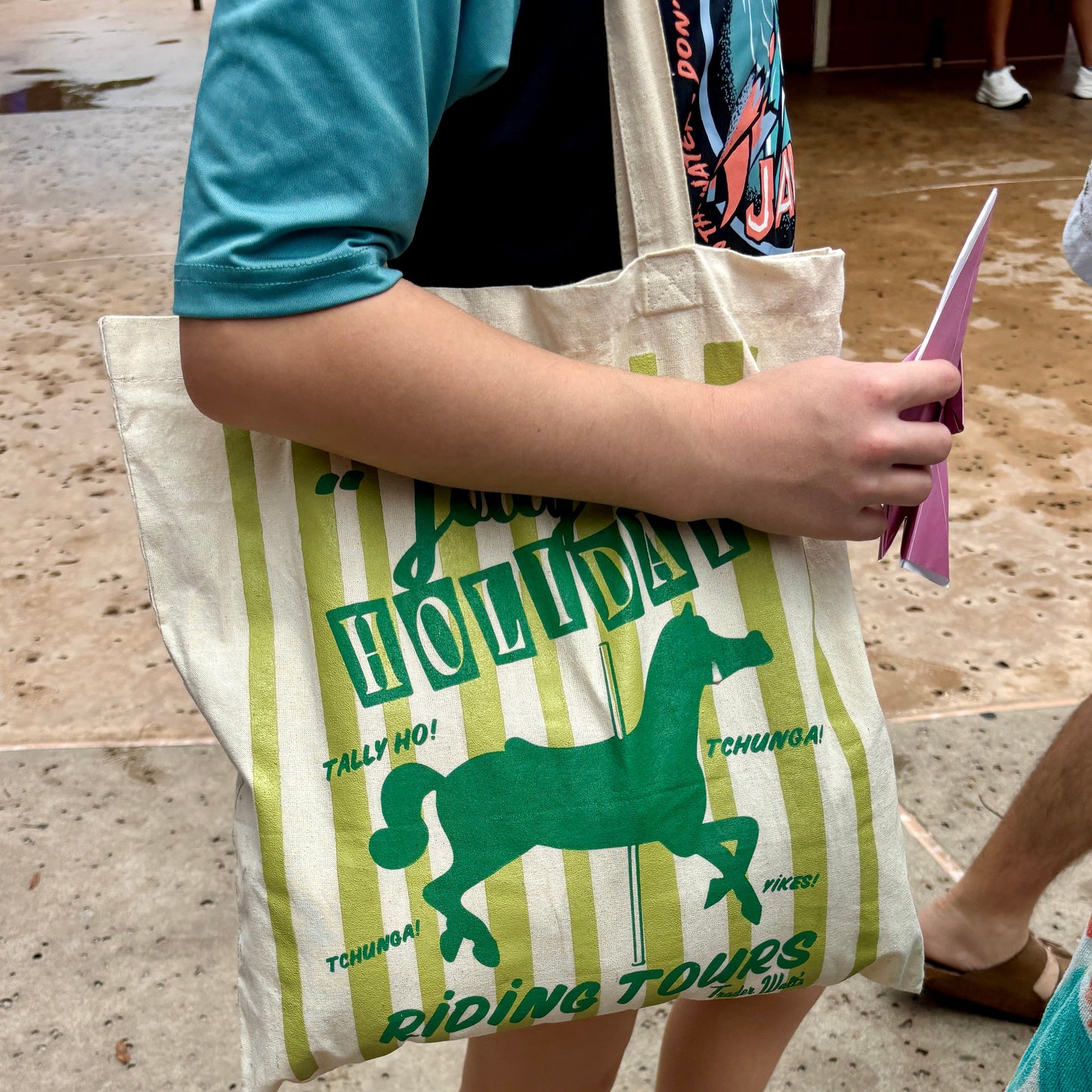 Retro Jolly Holiday Riding Tours Tote by Trader Walt’s, off-white cotton bag with green stripes and carousel horse graphic.