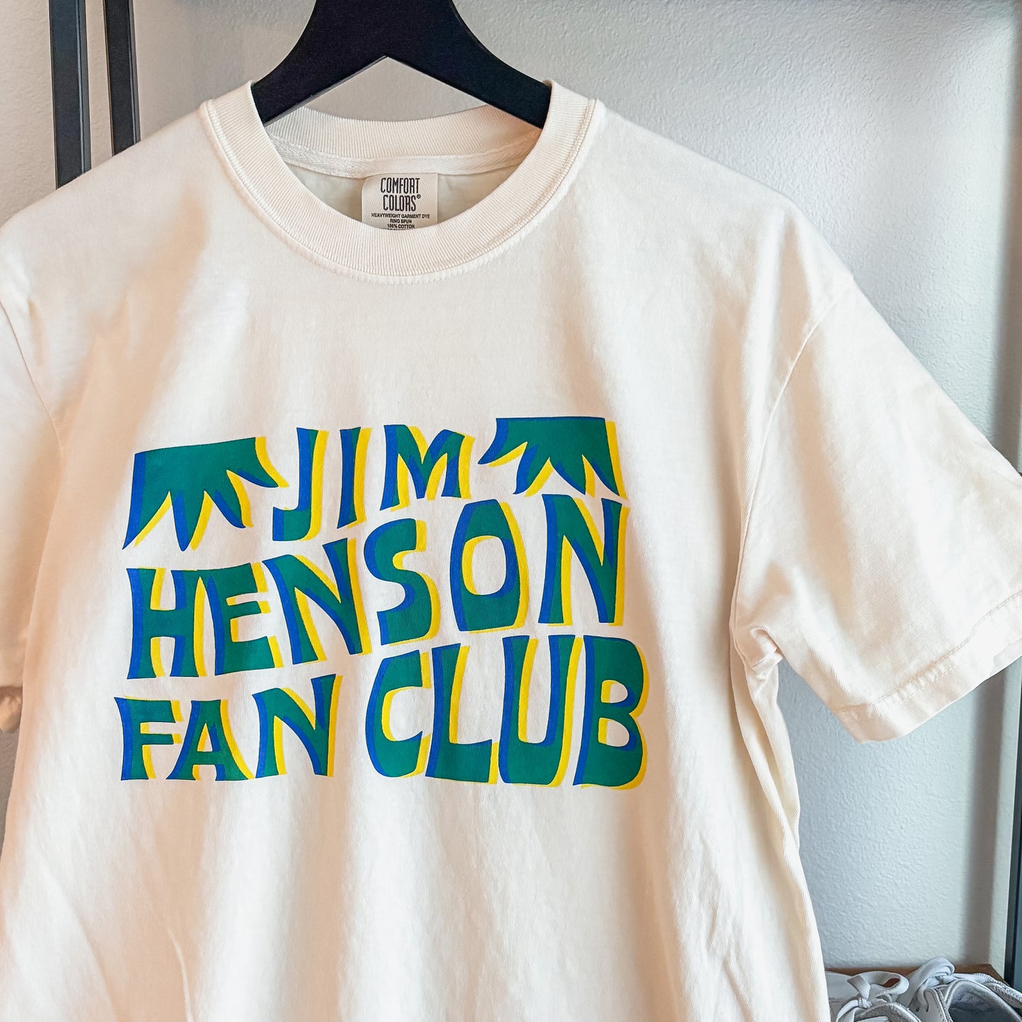 Jim Henson Fan Club T-shirt in cream with retro green and blue graphic lettering on a Comfort Colors garment-dyed tee.