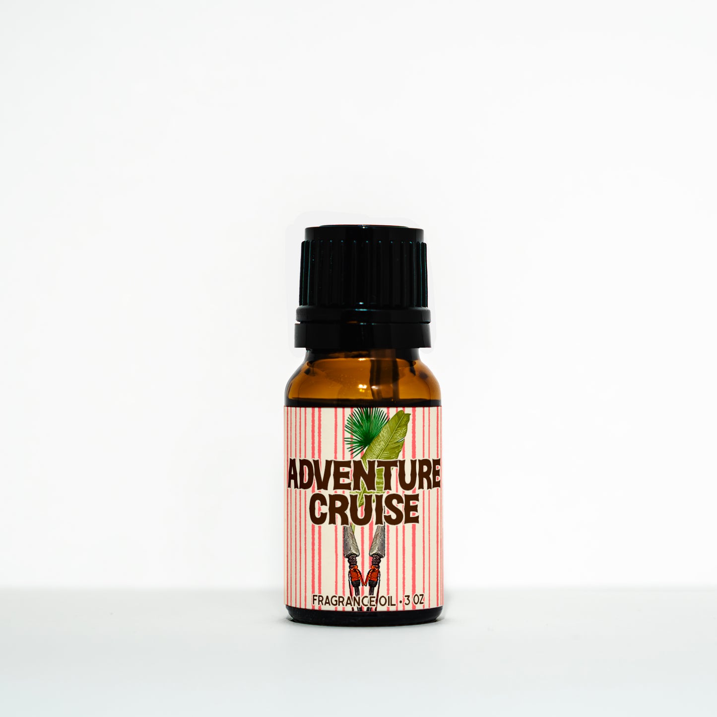 Bottle of 'Adventure Cruise' fragrance oil with a striped label on a white background