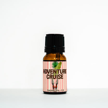 Bottle of 'Adventure Cruise' fragrance oil with a striped label on a white background