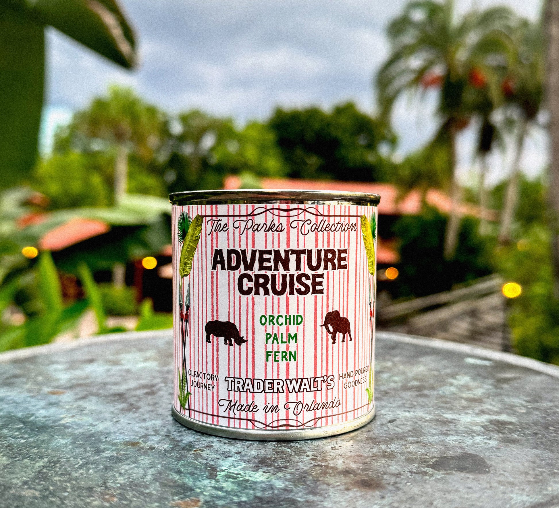 Adventure Cruise candle tin by Trader Walt’s with tropical orchid, palm, and fern scent.

Botanical-themed candle tin labeled Adventure Cruise, inspired by lush jungle fragrance.

Adventure Cruise candle tin featuring Trader Walt’s Parkes Collection design.