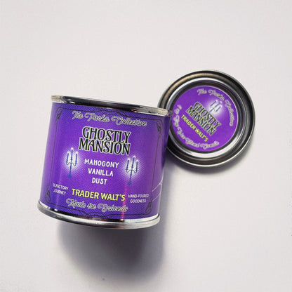 Ghostly Mansion purple tin candle by Trader Walt’s with Haunted Mansion–inspired design and mahogany, vanilla, and dust fragrance notes.