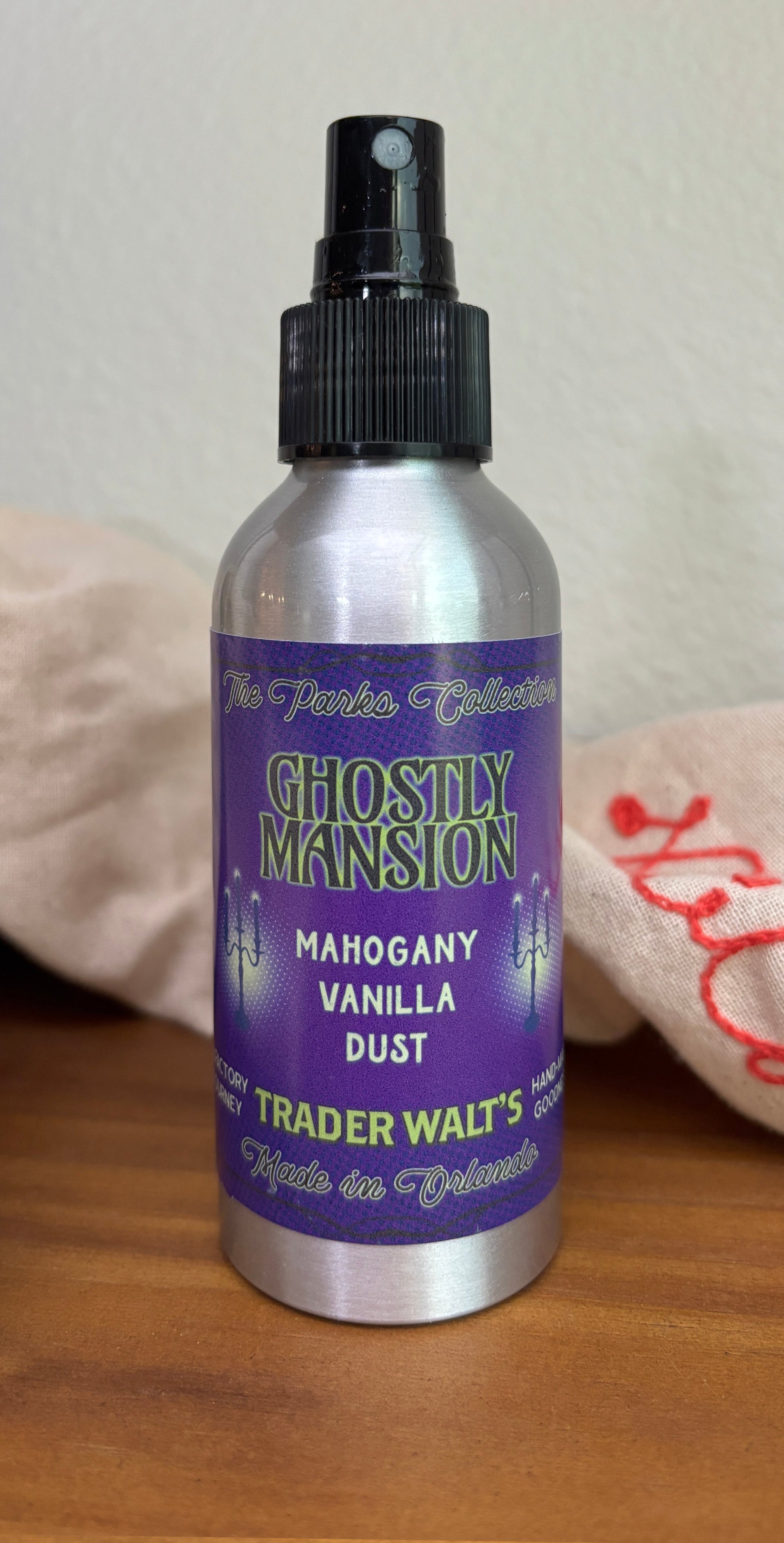 Haunted mansion–inspired room spray with fig leaves, cashmere, and cedar aroma, packaged in a Trader Walt’s bottle designed for spooky, atmospheric home fragrance.