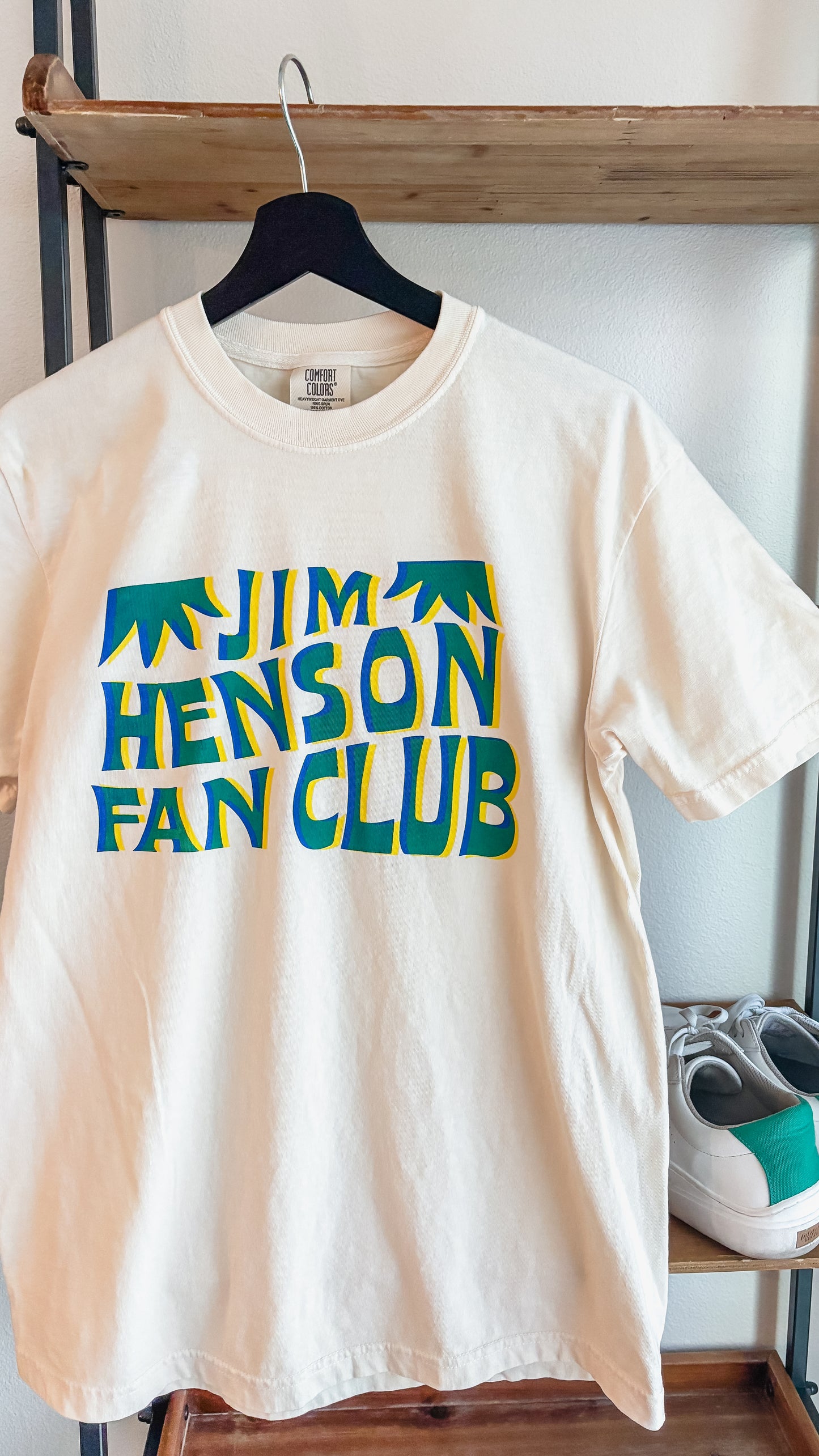 Jim Henson Fan Club T-shirt in cream with retro green and blue graphic lettering on a Comfort Colors garment-dyed tee.