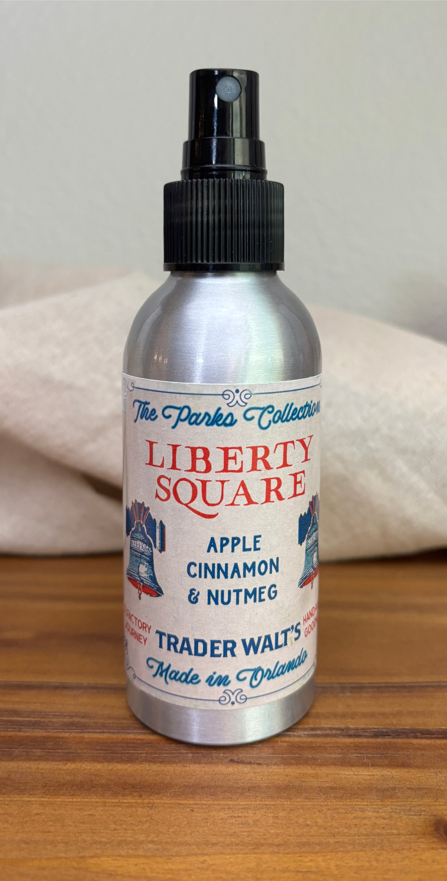 A Disney-inspired Liberty Square room Spray Bottle with warm apple, cinnamon, nutmeg, and vanilla. Cozy colonial vibes perfect for fans of classic American comfort scents.