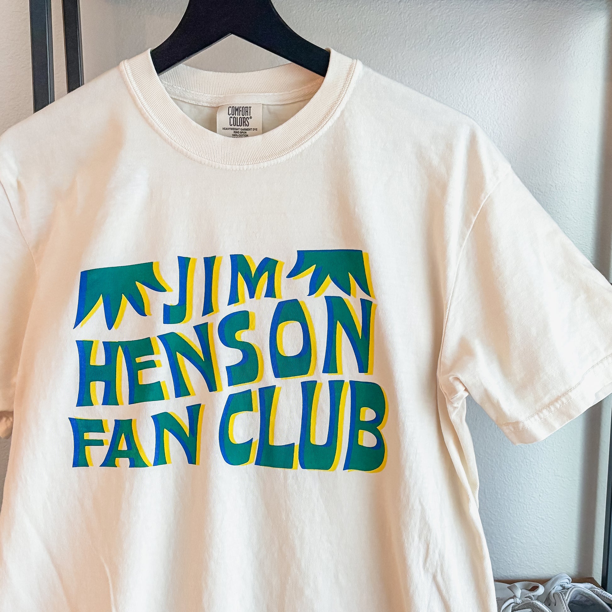 Jim Henson Fan Club T-shirt in cream with retro green and blue graphic lettering on a Comfort Colors garment-dyed tee.