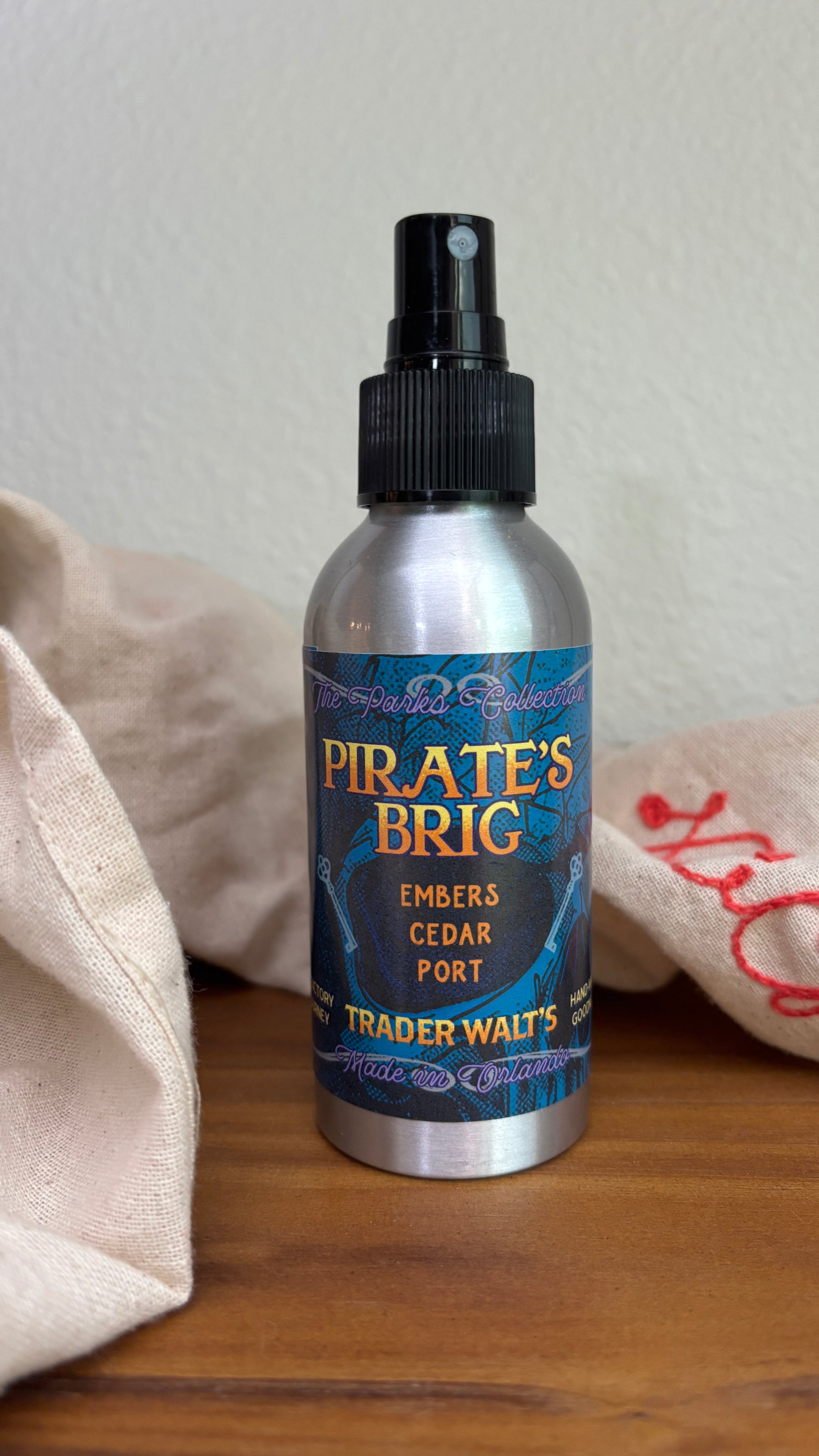 Pirate’s Brig room spray with smoky cedar and port fragrance by Trader Walt’s.

Metal bottle of Pirate’s Brig room spray offering embers, cedar, and vanilla notes.