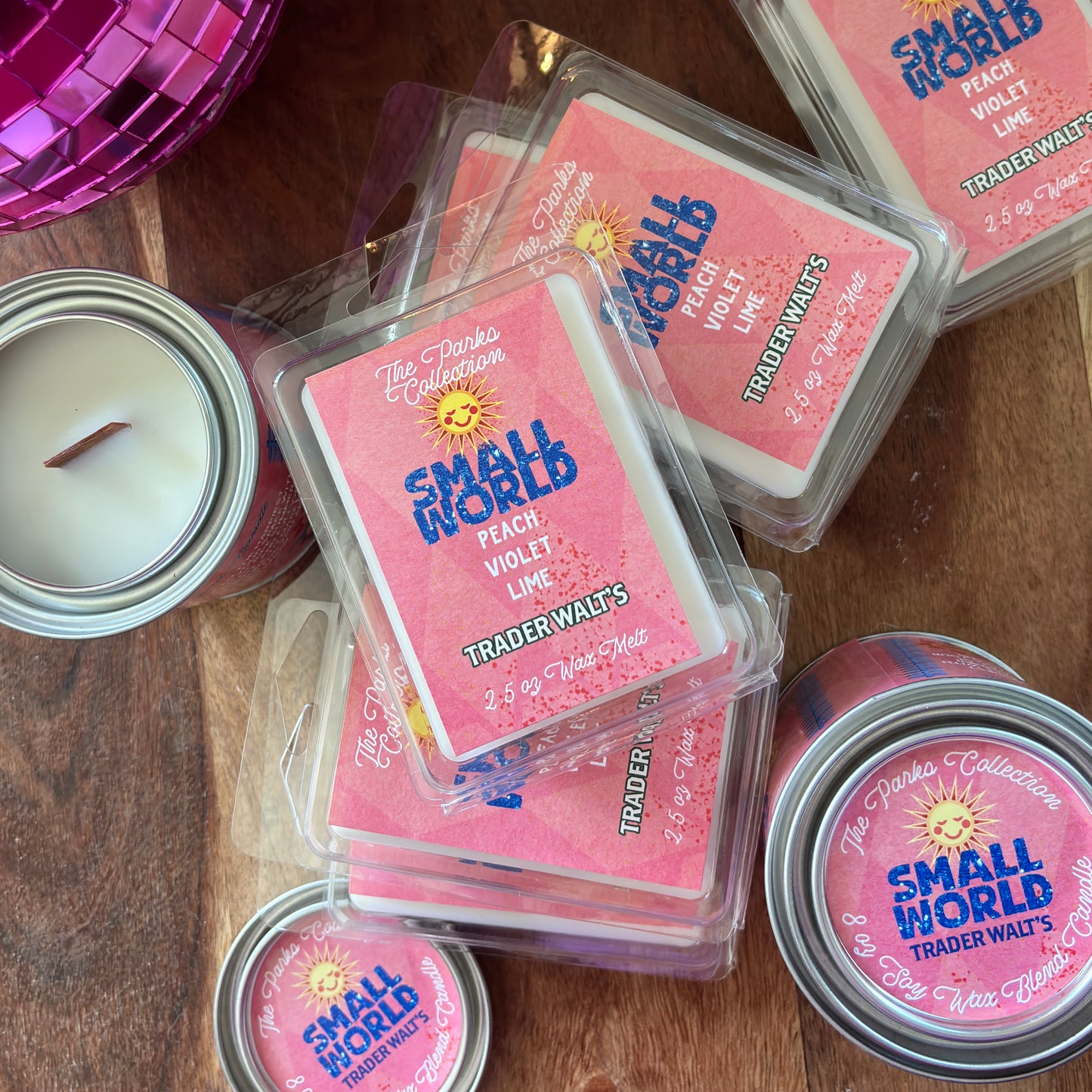 Small World candle and wax melts by Trader Walt’s featuring peach, violet, lime, and warm vanilla. Disney inspired fragrance with It’s a Small World vibes.